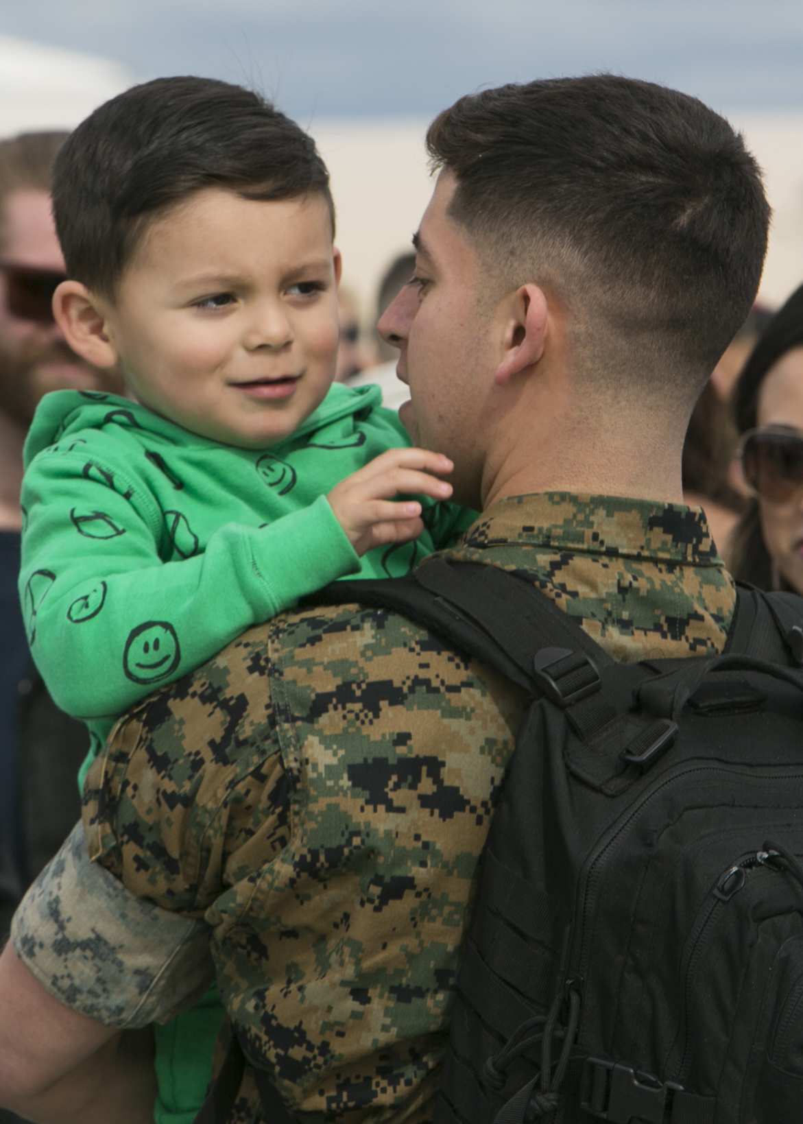 A Marine with Marine Fighter Attack Squadron (All-Weather) [VMFA(AW)] 225, Marine Aircraft Group (MAG) 11, 3rd Marine Aircraft Wing, reunites with his son at Marine Corps Air Station Miramar, Calif., March 10, following a six-month Unit Deployment Program (UDP) in Japan. Marines and Sailors trained alongside foreign forces throughout Guam, South Korea, and Japan as part of America's Expeditionary Force in Readiness. (U.S. Marine Corps photo by Lance Cpl. Julian Elliott-Drouin)