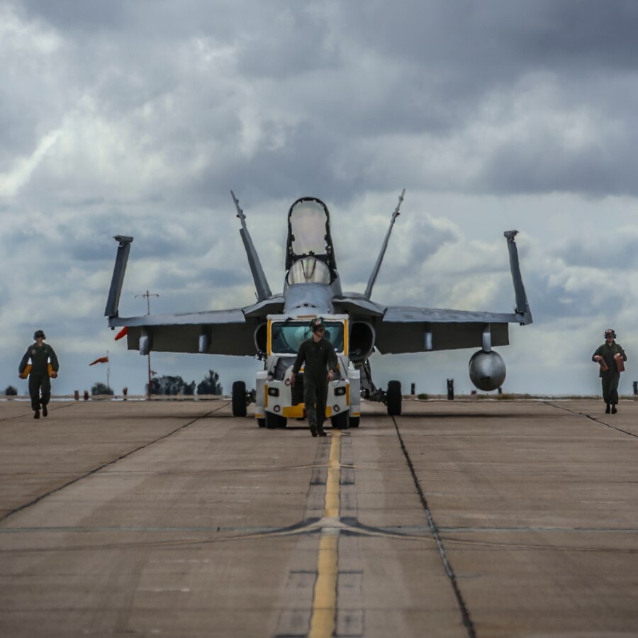 U.S. Marines with Marine Fighter Attack Squadron (VMFA) 232, Marine Aircraft Group (MAG) 11, 3rd Marine Aircraft Wing (MAW), tow an aircraft prior to takeoff at Marine Corps Air Station (MCAS) Miramar, Calif., March 8. The Red Devils are in the Unit Deployment Program rotation and are preparing to depart for MCAS Iwakuni, Japan. Their mission during the six-month deployment is to strengthen relationships, modernize U.S. alliances and support joint security in the Indo-Pacific region. (U.S. Marine Corps photo by Lance Cpl. Levi J. Guerra)