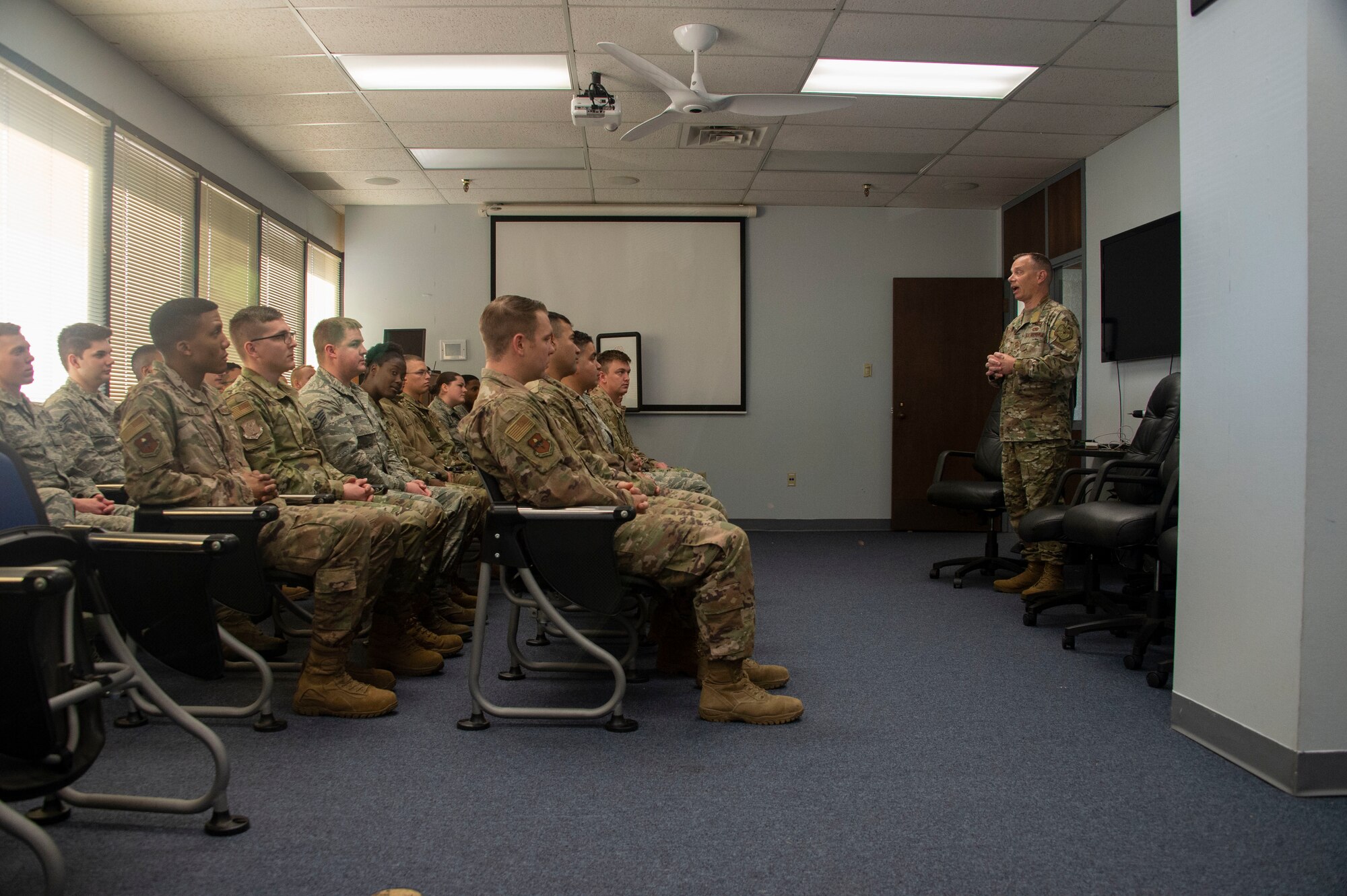 U.S. Air Force Chief Master Sgt. Erik Thompson, command chief of the 19th Air Force, talks to Airmen attending Airman Leadership School