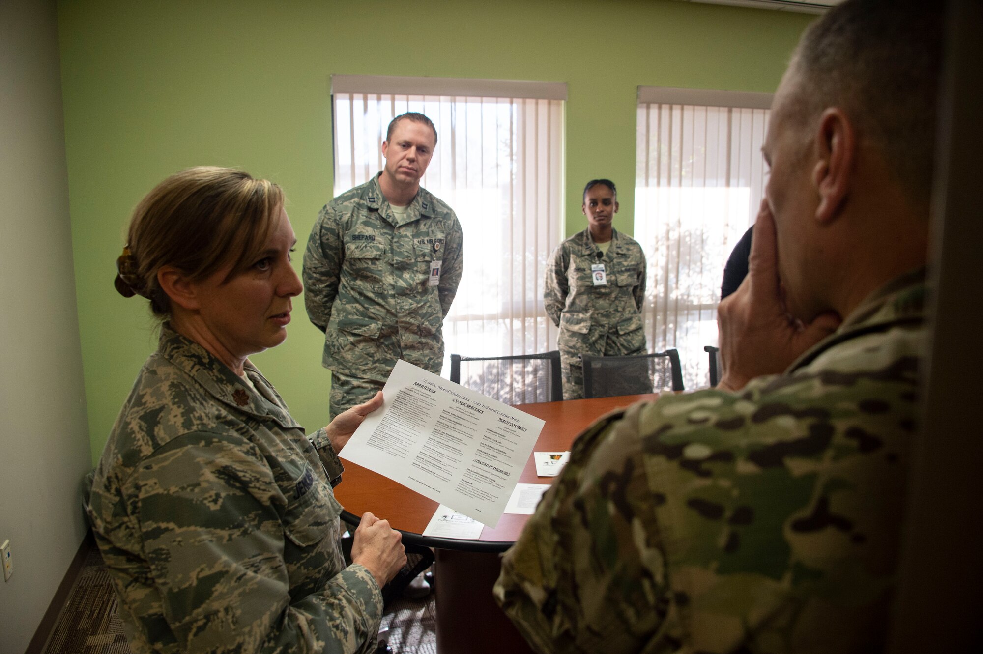 The 97th Medical Operations Mental Health office showcases the Passport to Resiliency program to U.S. Air Force Chief Master Sgt. Erik Thompson, command chief of the 19th Air Force