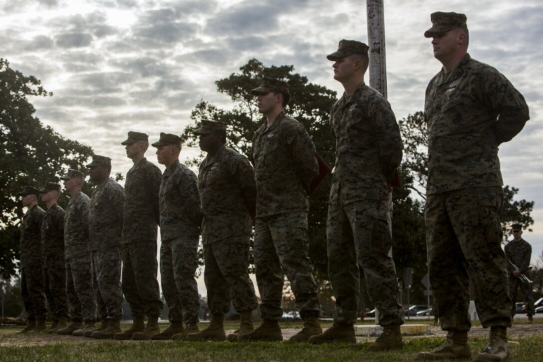 U.S. Marines and Sailors with 2d Marine Division, II Marine Expeditionary Force,  stand at parade rest after receiving awards during a morning colors and awards ceremony on Camp Lejeune, N.C., Feb. 26, 2019. The morning colors and awards ceremony is held quarterly to honor the colors, as well as recognize Marines and Sailors for their accomplishments. (U.S. Marine Corps photo by Lance Cpl. Kensie S. Milner)