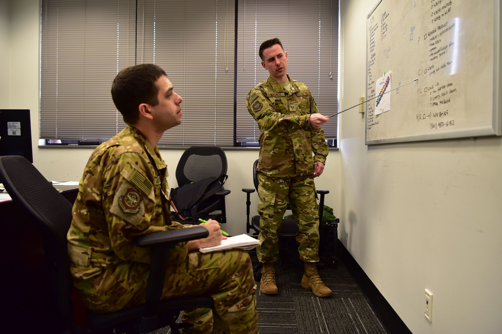 Airman instructs pilot on integrated air defense system kill chain.