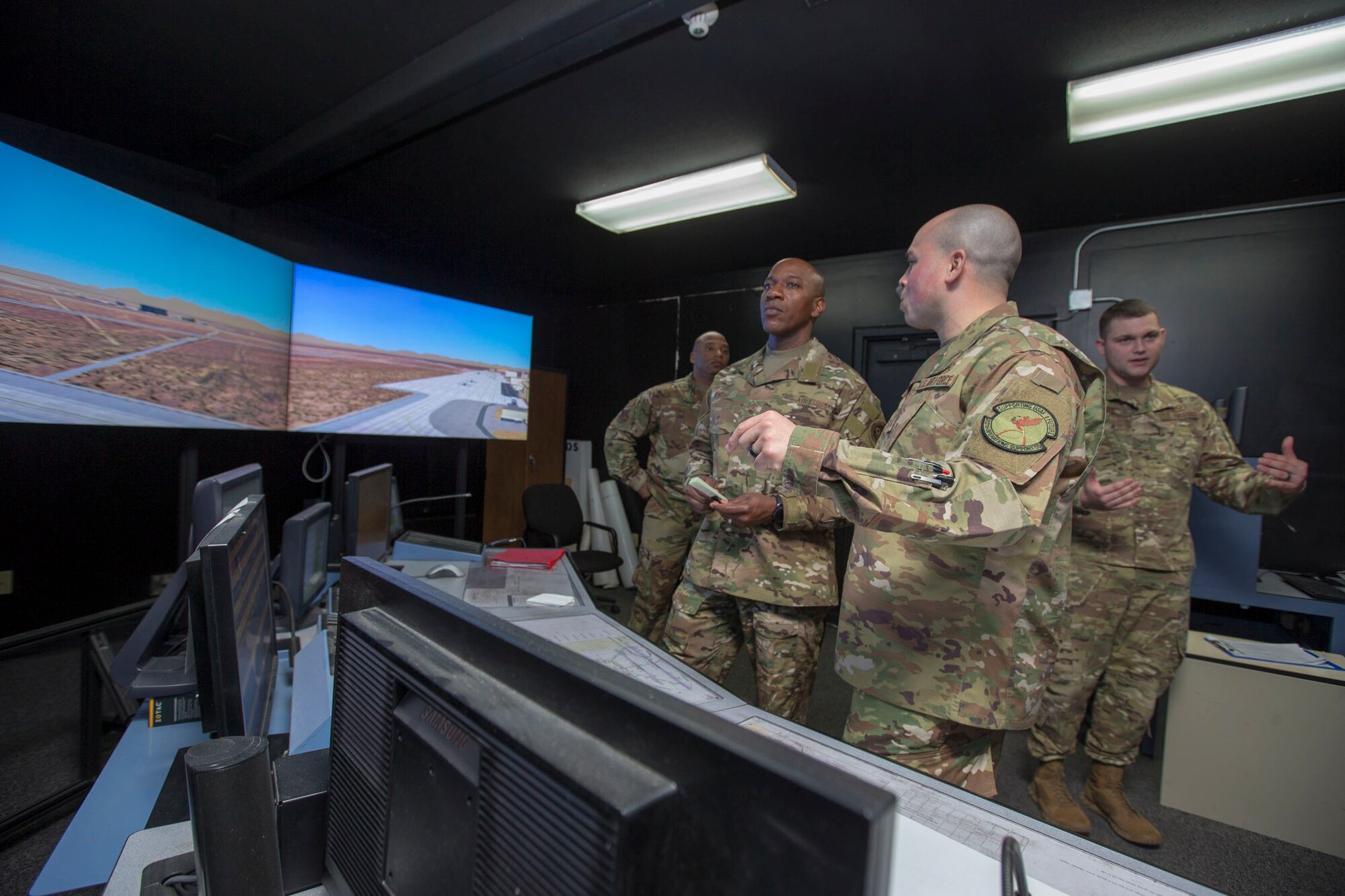 Senior Master Sgt. Joshua Matias, 412th Operations Support Squadron (right), briefs Chief Master Sgt. of the Air Force Kaleth O. Wright at the Edwards Air Force Base tower simulator used for training, March 19, 2019. Matias is a current Air Force 12 Outstanding Airmen of the Year awardee. Wright received a two-day tour of Edwards Air Force Base. (U.S. Air Force photo by Christopher Okula)