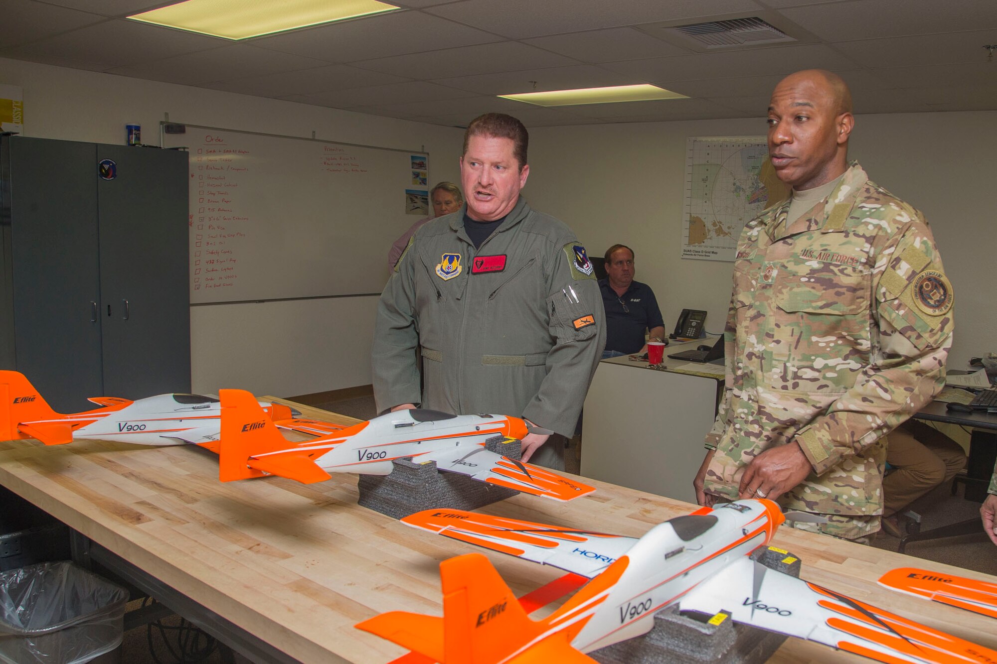 Anthony Accurso, 412th Test Wing Emerging Technologies Combined Test Force (left), discusses small unammed aircraft systems with Chief Master Sgt. of the Air Force Kaleth O. Wright, March 19, 2019. (U.S. Air Force photo by Christopher Okula)