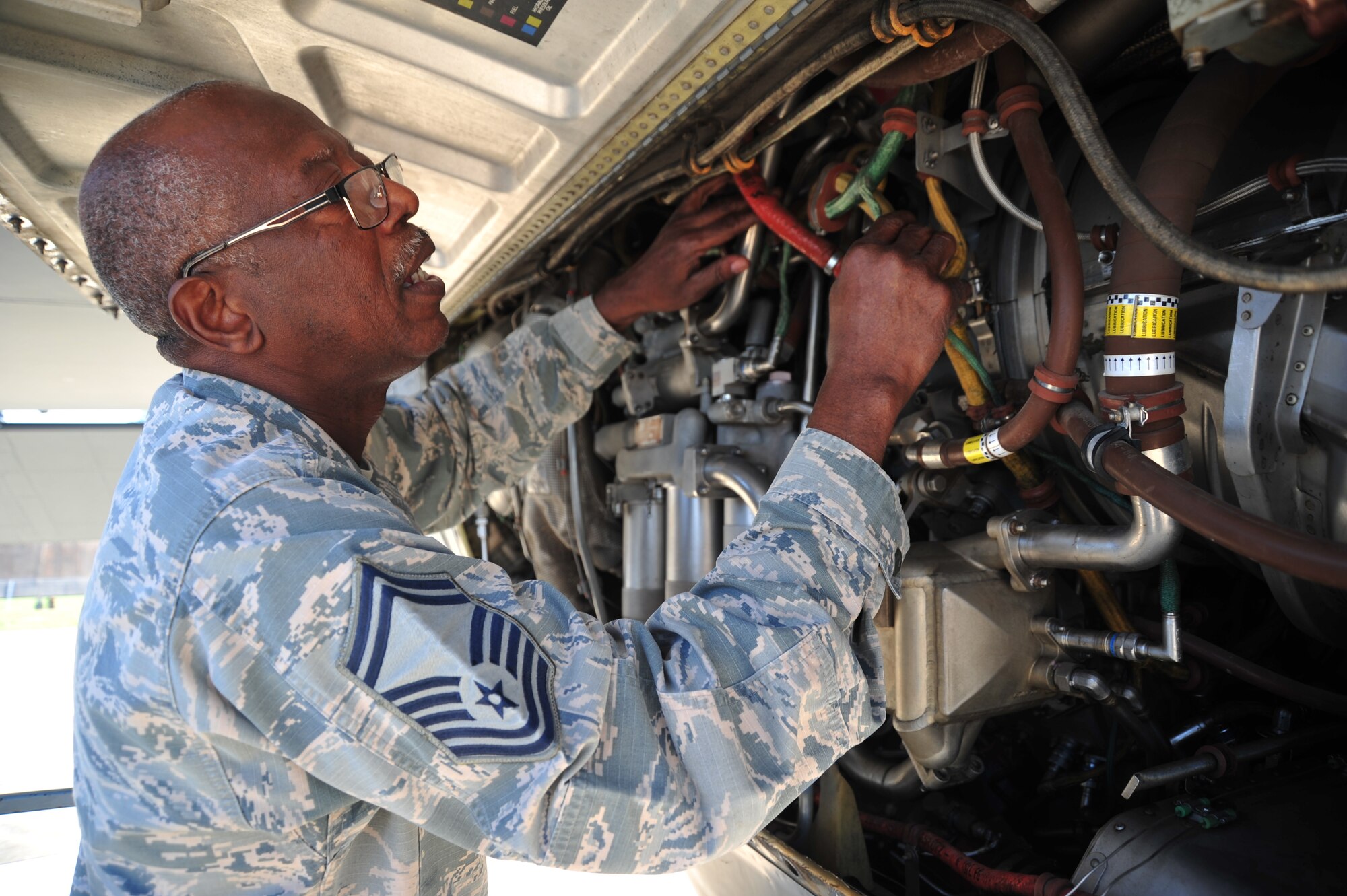 Senior Master Sgt. Charles Moore, 803rd Aircraft Maintenance Squadron production superintendent, examines a C-130J Super Hercules engine March 20, 2019. His retires from a 33 year military career in the 403rd Wing, April 1, 2019. (U.S. Air Force photo by TSgt. Michael Farrar)