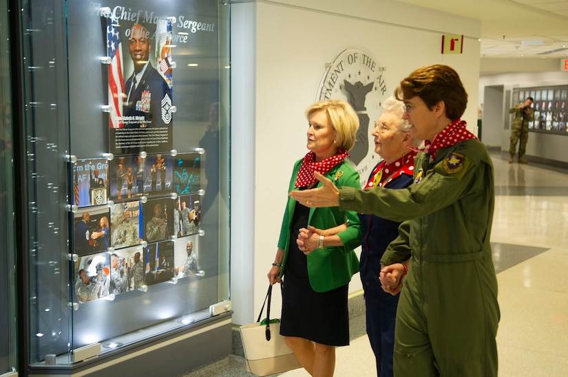 Thee women look at a display in the Pentagon.