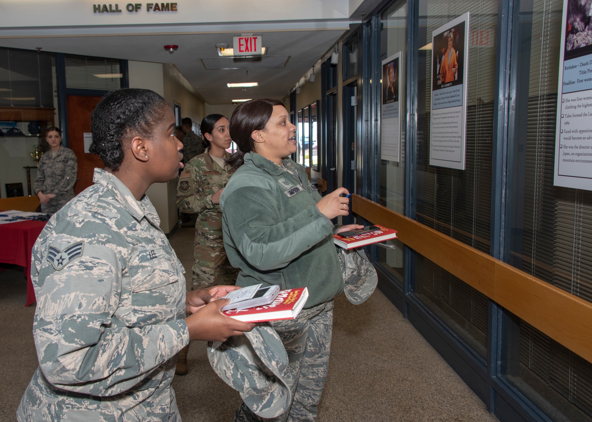 U.S. Air Force Senior Airman Imani Lee and Tech. Sgt. Porscha Simpson, both with the 60th Diagnostic and Therapeutics Squadron, attend the Women’s History Month social gathering, March 20, 2019, at Travis Air Force Base, California. Since 1987, the month of March has been designated to celebrate the historical and ongoing achievements and contributions of women. Members of the Women Inspiring the Next Generation’s Success committee were responsible for organizing the event which included an exhibit highlighting extraordinary female heroes and featured speakers prominent in the Travis community. (U.S. Air Force photo by Heide Couch)