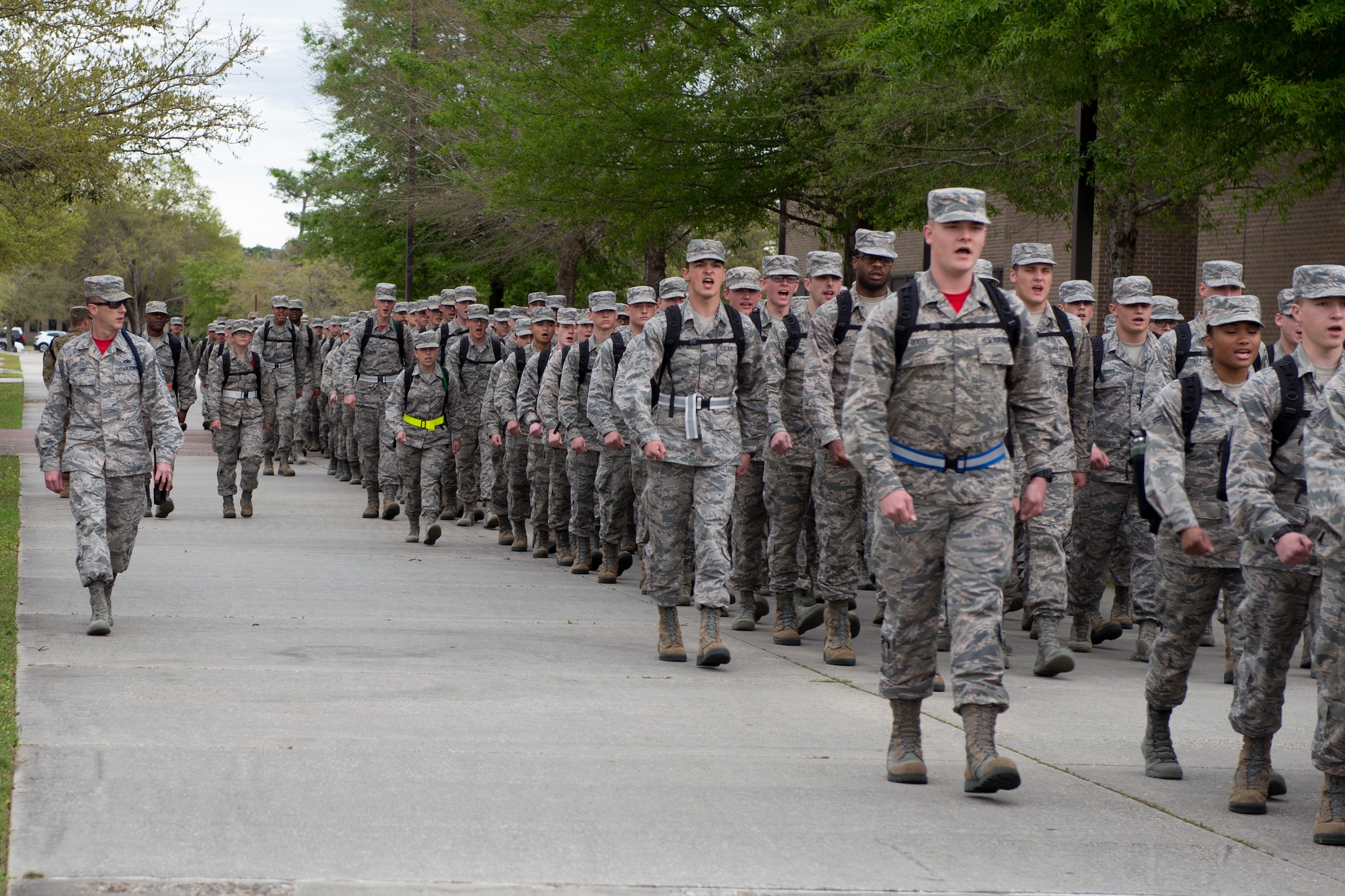 U.S. Air Force Tech. Sgt. Joshua Free, 336th Training Squadron military training leader, marches the 336th TRS students to their dorms at Keesler Air Force Base, Mississippi, March 15, 2019. While marching, Free ensures the Airmen maintain their military bearing in order to continue the disciplinary foundation provided in Basic Military Training. (U.S. Air Force photo by Airman 1st Class Kimberly L. Mueller)