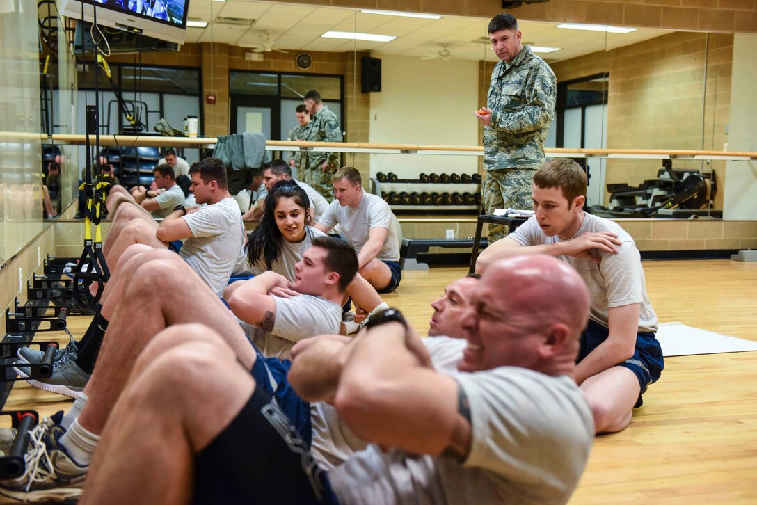 Airmen perform the sit-up portion of the Air Force physical fitness test March 2, 2019, at the Warrior Fitness Center on Hill Air Force Base, Utah.