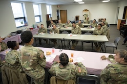 Soldiers from the 1st Theater Sustainment Command (TSC) listen to the panel of Sisters in Arms, the unit’s newest mentorship program, discuss the forum’s purpose and issues it will address in the coming months March 15. (U.S. Army photo by Master Sgt. Jonathan Wiley)