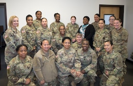 Attendees of the 1st Theater Sustainment Command’s (TSC) Sisters in Arms meeting pose for a group shot March 15. (U.S. Army photo by Master Sgt. Jonathan Wiley)