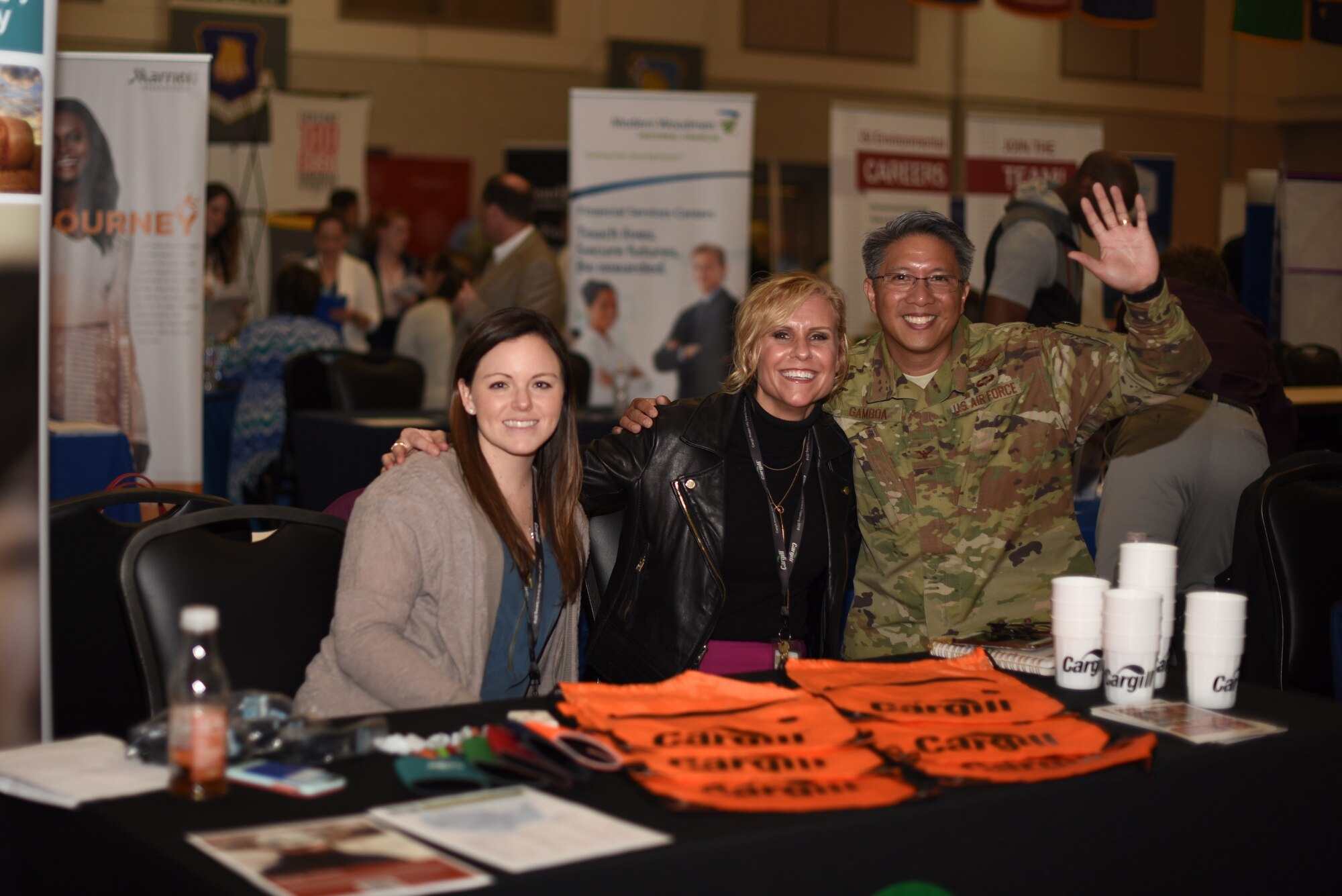 Col. Anthony Gamboa, 22nd Mission Support Group commander, poses with Alisa Brown, Cargill senior employee experience specialist and Paige Baldwin, Cargill employee relations specialist for a photo at the job fair March 20, 2019 at McConnell Air Force Base, Kan. Cargill was one of 70 employers to attend to the 2019 Job Fair hosted by McConnell. (U.S. Air Force photo by Airman 1st Class Alexi Myrick)