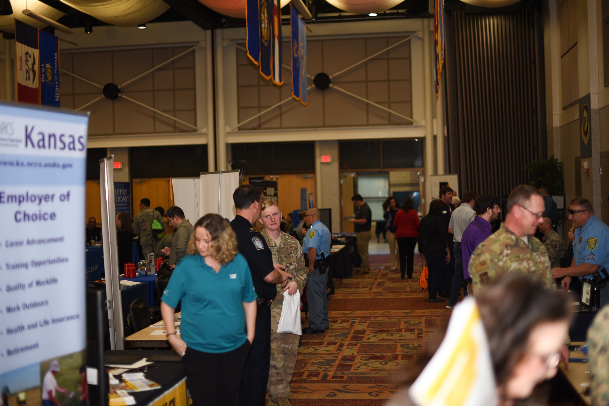 Members of McConnell visit the job fair March 20, 2019 at McConnell Air Force Base, Kan. The job fair was open to active duty, spouses, civilians, retirees and veterans looking for future employment. (U.S. Air Force photo by Airman 1st Class Alexi Myrick)