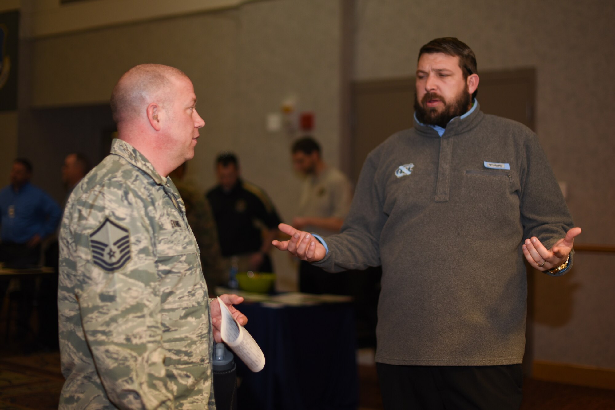 Master Sgt. Christopher Evans, 22nd Force SUpport Squadron career assistance advisor, discusses employment opportunities at the job fair March 20, 2019 at McConnell Air Force Base, Kan. The 22nd FSS hosted the job fair in order to help those with Team McConnell prepare for their future. (U.S. Air Force photo by Airman 1st Class Alexi Myrick)