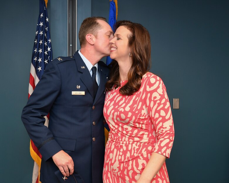 U.S. Air Force Col. Christopher Holland pins on the rank of colonel.