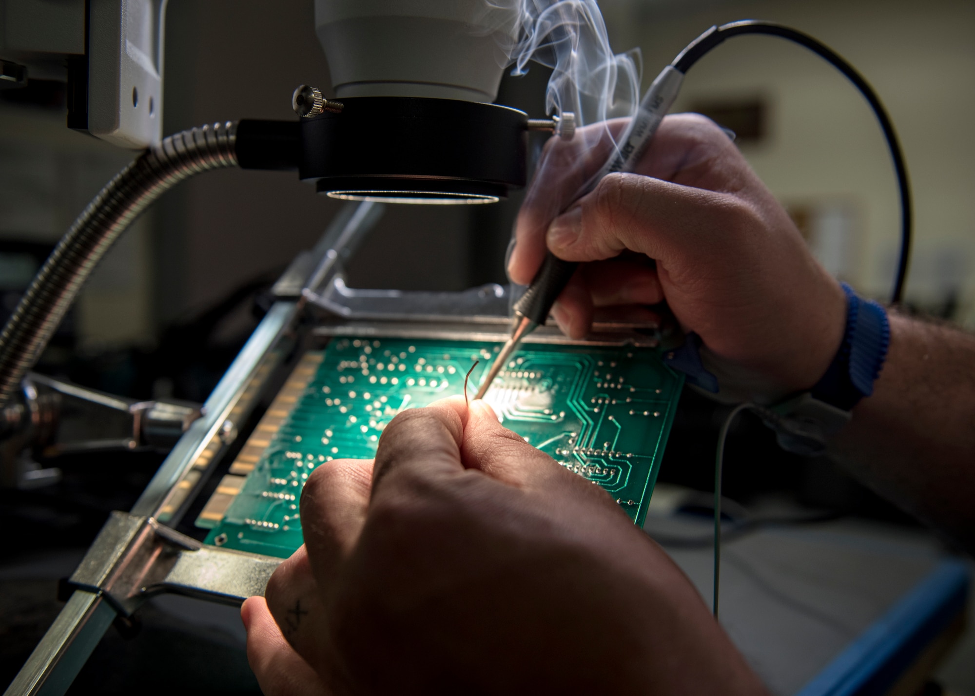 U.S. Air Force Tech. Sgt. Jeremy Blackwell, 92nd Maintenance Group Air Force Repair Enhancement Program non-commissioned officer in charge, solders a circuit board at Fairchild Air Force Base, Washington, March 20, 2019. The 92nd Maintenance Group Air Force Repair Enhancement Program is ran by Airmen who take pride in contributing to the ‘Green in 19’ initiative by restoring what would-be waste into money-saving treasure. (U.S. Air Force photo by Airman 1st Class Whitney Laine)