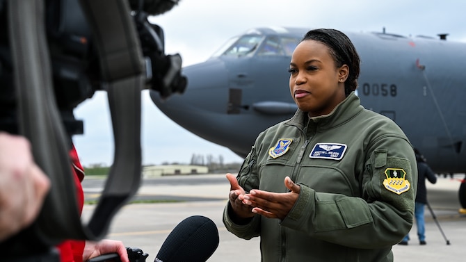 Capt. Austyn Wilson, 20th Bomb Squadron weapons system officer deployed from Barksdale Air Force Base, La., is interviewed by a local media outlet during a press conference at RAF Fairford, March 19, 2019. The deployment of strategic bombers to the U.K. helps exercise RAF Fairford as U.S. Air Forces in Europe’s forward operating location for bombers and includes joint and allied training in the U.S. European Command theater to improve U.S. and allied interoperability. (U.S. Air Force photo by Airman 1st Class Tessa B. Corrick)