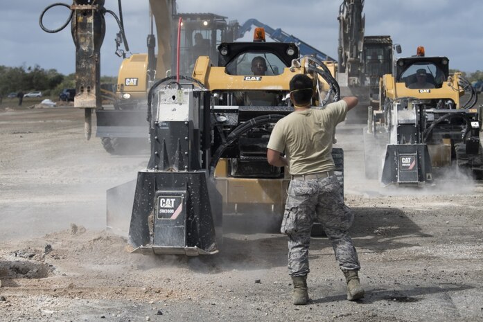Students from Silver Flag class 19-05 use asphalt cutters to isolate damged areas of a runway, as part of a rapid airfield damage repair exercise, March 7, 2019, on Andersen Air Force Base Guam. This exercise marked the first time that a full scale airfield assessment, clearance and repair took place in the same exercise. (U.S. Air Force photo by Senior Airman Zachary Bumpus)