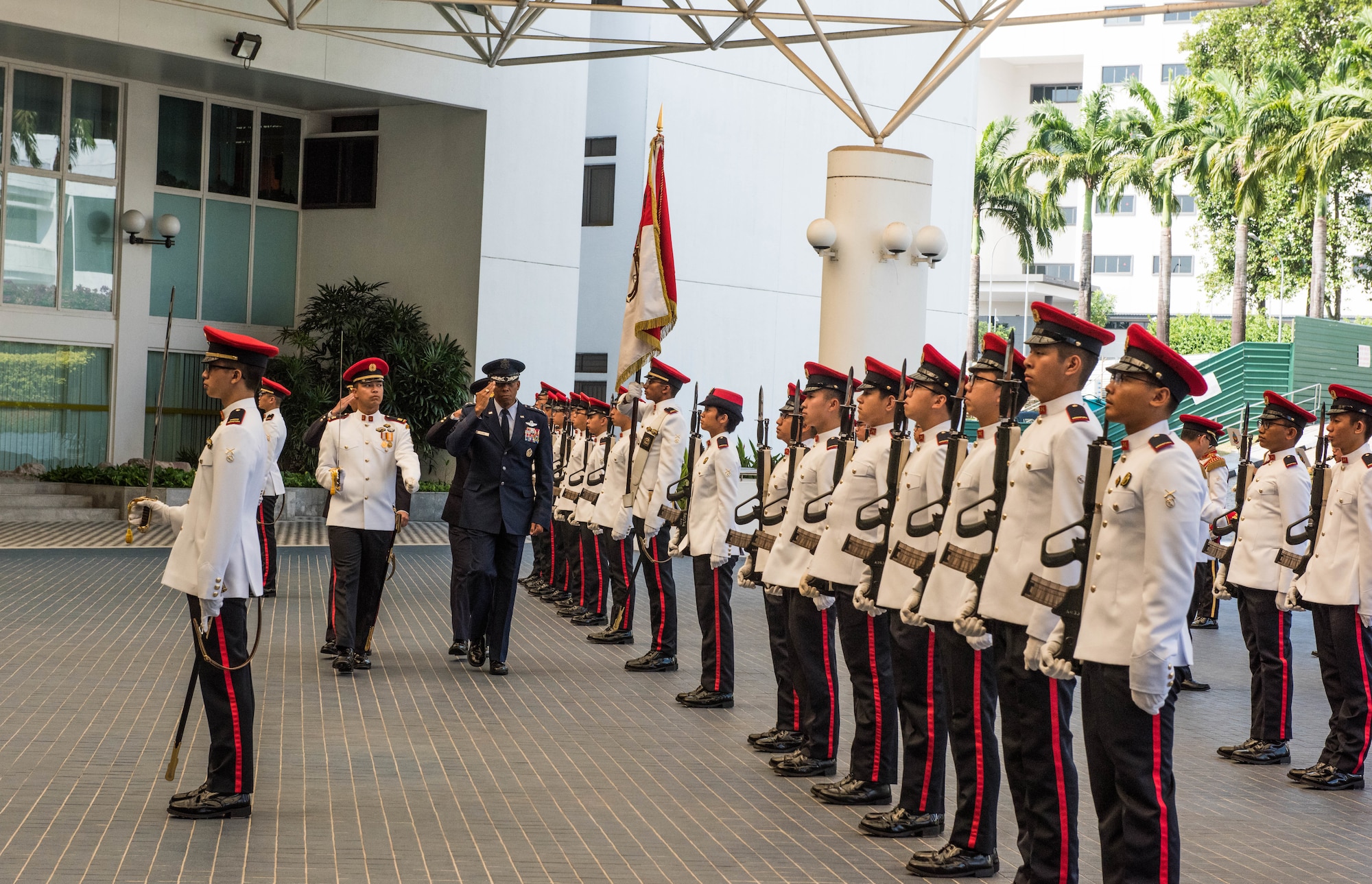U.S. Air Force Gen. CQ Brown, Jr., Pacific Air Forces commander, salutes during the Guard of Honor at the Ministry of Defence, Singapore, March 20, 2019.