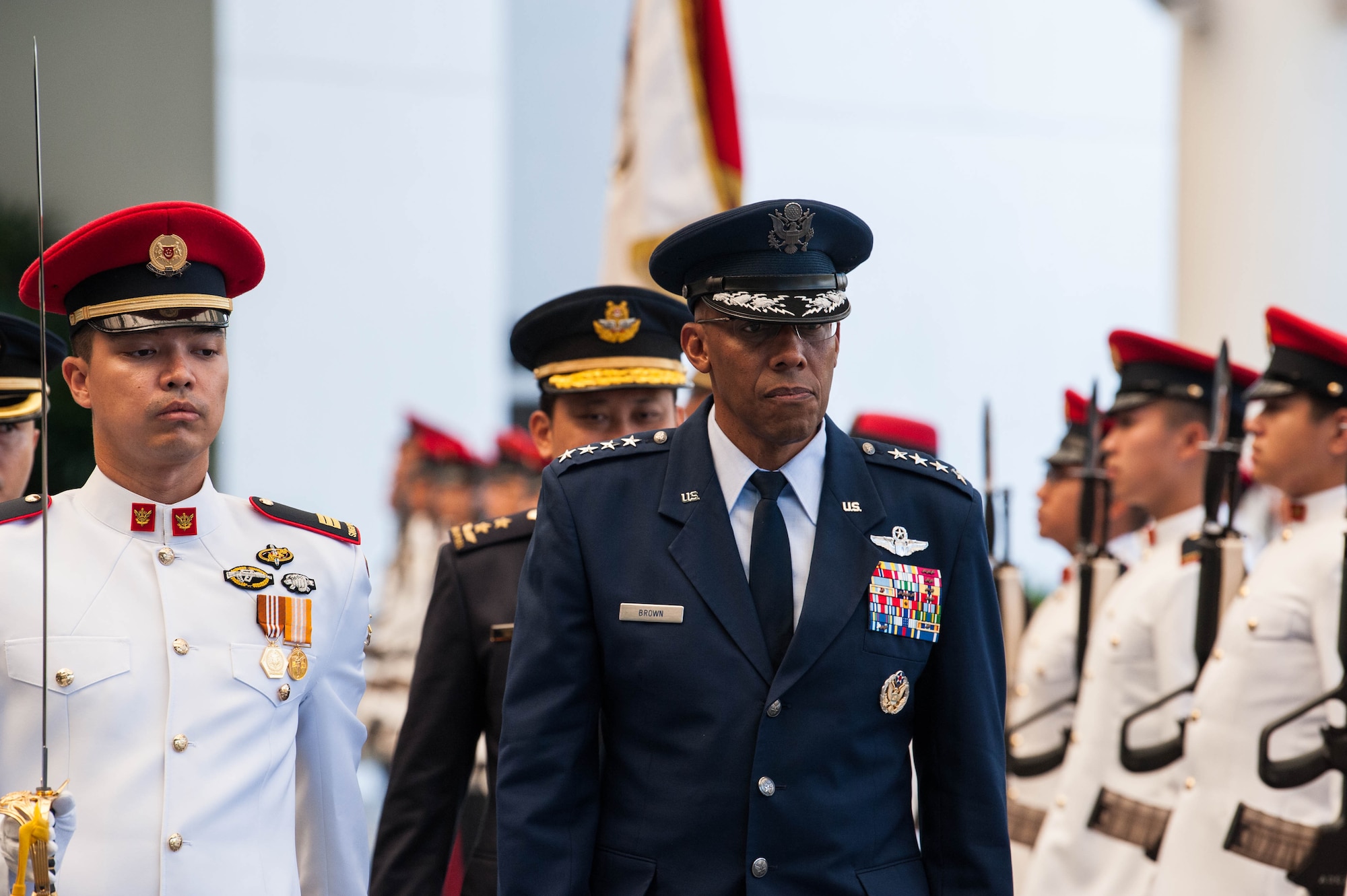 U.S. Air Force Gen. CQ Brown, Jr., Pacific Air Forces commander, conducts a review of the Guard of Honor during a visit to the Ministry of Defence, Singapore, March 20, 2019.