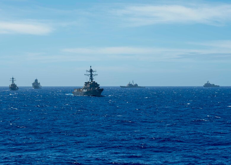 PHILIPPINE SEA (March 14, 2019) The Arleigh Burke-class guided-missile destroyer USS McCampbell (DDG 85), the Arleigh Burke-class guided-missile destroyer USS Milius (DDG 69), the amphibious transport dock ship USS Green Bay (LPD 20), the Ticonderoga-class guided-missile cruiser USS Chancellorsville (CG 62), and the amphibious dock landing ship USS Ashland (LSD 48) maneuver while operating in the Philippine Sea. U.S. Navy warships train together to increase the tactical proficiency, lethality, and interoperability of participating units in an Era of Great Power Competition.