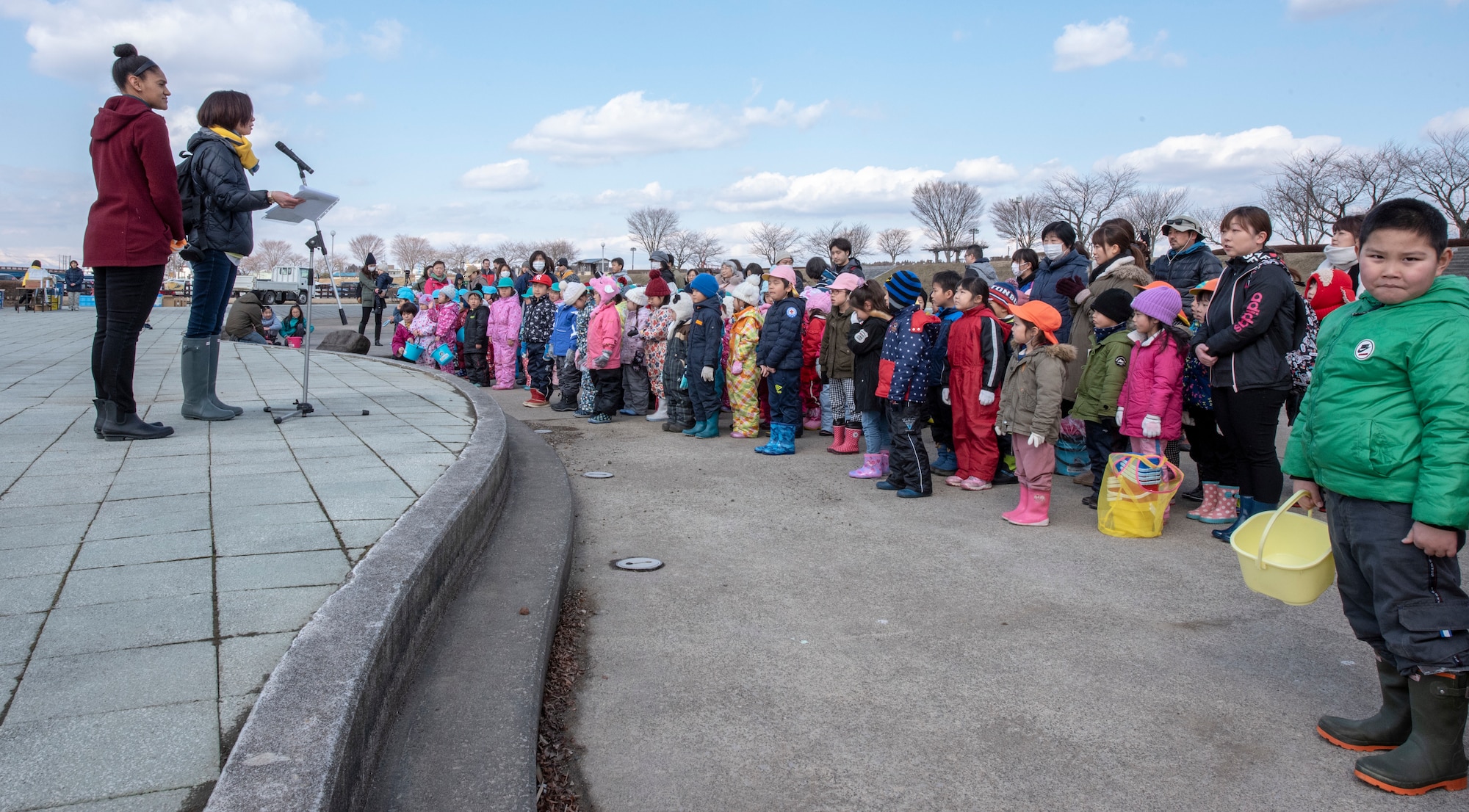 Hundreds of American and Japanese families gather at the Oirase River for the 22nd Annual Baby Salmon Release at Shimoda Salmon Park, Japan, March 16, 2019. This event allowed families to release baby salmon into the river. The salmon later return as adults for the Oirase River Salmon Festival later in the year. Misawa Air Base leadership participated in the event, sharing in cultural experiences with their Japanese neighbors. (U.S. Air Force photo by Branden Yamada)