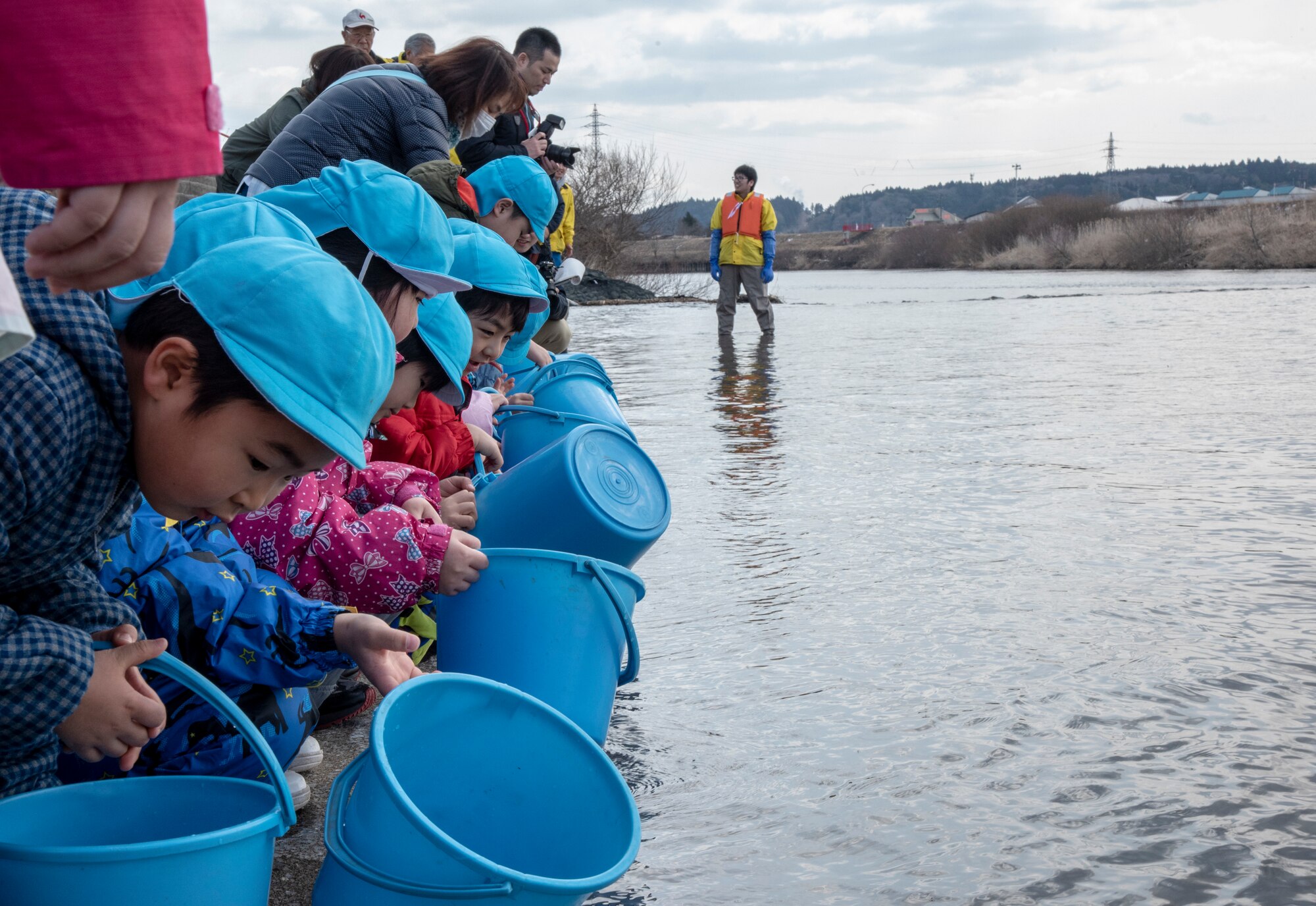 Children release baby salmon into the Oirase River for the 22nd Annual Baby Salmon Release at Shimoda Salmon Park, Japan, March 16, 2019. The baby salmon released during this event were bred from last season’s salmon catch. After living three to five years in the Northern Sea, the fish find their way back to the river to create future generations.