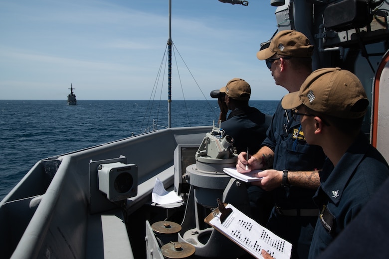 SOUTH CHINA SEA (March 21, 2019) Sailors translate flashing-light Morse code received from Philippine Navy vessel BRP Ramon Alcaraz (FF 16) aboard the Avenger class mine countermeasures ship USS Chief (MCM 14) during a maritime cooperative activity. Chief, part of Mine Countermeasures Squadron 7, is operating in the Indo-Pacific region to enhance interoperability with partners and serve as a ready-response platform for contingency operations.