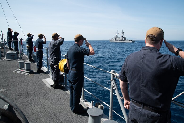 SOUTH CHINA SEA (March 21, 2019) Sailors aboard the Avenger class mine countermeasures ship USS Chief (MCM 14) render honors to Philippine Navy vessel BRP Ramon Alcaraz (FF 16) after completing a maritime cooperative activity. Chief, part of Mine Countermeasures Squadron 7, is operating in the Indo-Pacific region to enhance interoperability with partners and serve as a ready-response platform for contingency operations.