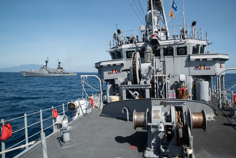 SOUTH CHINA SEA (March 21, 2019) The Avenger class mine countermeasures ship USS Chief (MCM 14) transits the South China Sea with Philippine Navy vessel BRP Ramon Alcaraz (FF 16) after completing a maritime cooperative activity. Chief, part of Mine Countermeasures Squadron 7, is operating in the Indo-Pacific region to enhance interoperability with partners and serve as a ready-response platform for contingency operations.