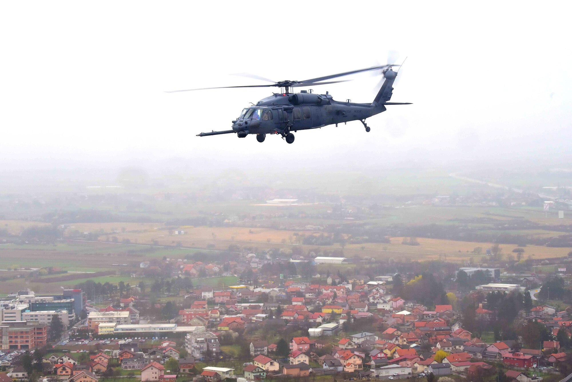 A U.S. Air Force HH-60G Pave Hawk, based out of Aviano Air Base, Italy, transports simulated casualties during a Non-combatant Evacuation Operation exercise near Zagreb, Croatia, March 18, 2019. NEO exercises simulate the ordered or authorized departure of civilians and non-essential military personnel from danger in an overseas country. (U.S. Air Force photo by Senior Airman Kevin Sommer Giron)