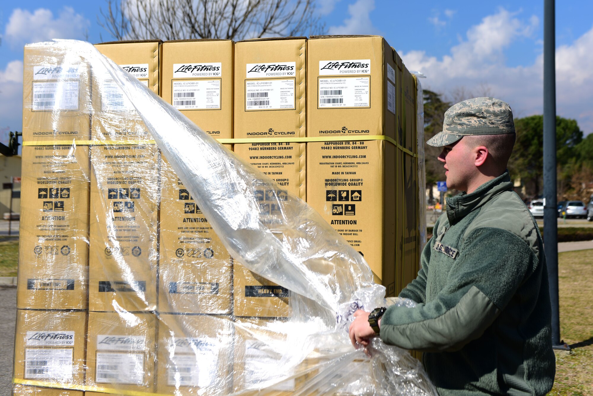 Senior Airman Dalton Ellis, 31st Force Support Squadron shift leader, unpacks workout bikes at Aviano Air Base, Italy, March 5, 2019. 31st FSS Airmen replaced broken cardio equipment at the Wyvern and Dragon Fitness Centers. (U.S. Air Force photo by Senior Airman Kevin Sommer Giron)