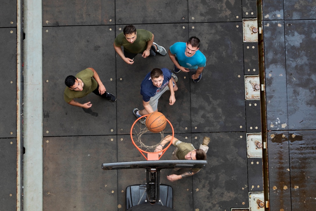 U.S. Marines with the 22nd Marine Expeditionary Unit play basketball in the well deck of the Whidbey Island-class dock landing ship USS Fort McHenry. In their free time, Marines played basketball for fun and to improve physical fitness. Marines and Sailors with the 22nd MEU and Kearsarge Amphibious Ready Group are currently deployed to the U.S. 5th Fleet area of operations in support of naval operations to ensure maritime stability and security in the Central Region, connecting the Mediterranean and the Pacific through the western Indian Ocean and three strategic choke points.