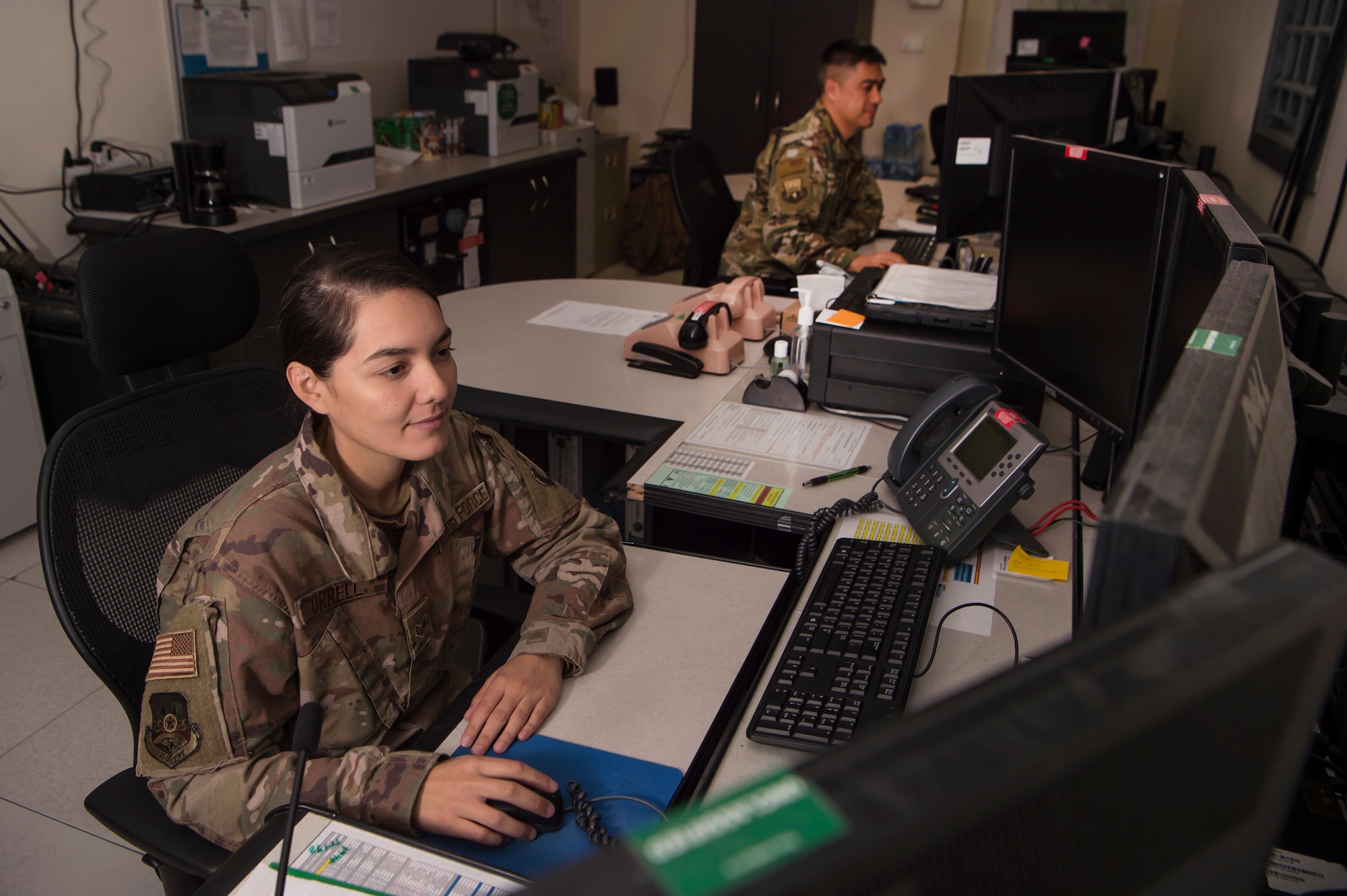 Senior Airman Anelle Orrell, 379th Air Expeditionary Wing (AEW) command post controller, gathers installation information March 18, 2019, at Al Udeid Air Base, Qatar. Airmen from the command post are responsible for gathering and relaying information to entities across base to include aircraft maintenance requirements, security forces incidents, and notifications that ensure the safety of Airmen and other assets on base. (U.S. Air Force photo by Tech. Sgt. Christopher Hubenthal)