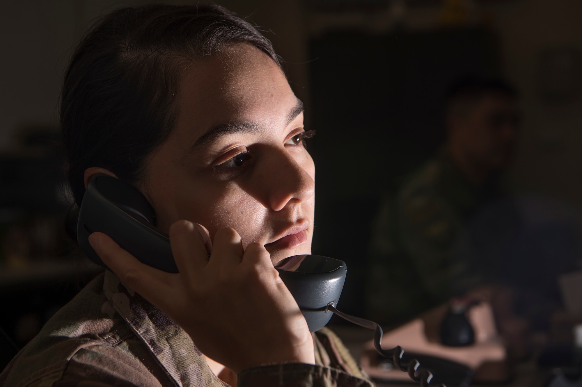 Senior Airman Anelle Orrell, 379th Air Expeditionary Wing command post controller, gathers information for distribution March 18, 2019, at Al Udeid Air Base, Qatar. Airmen from the command post are responsible for gathering and relaying information to entities across base to include aircraft maintenance requirements, security forces incidents, and notifications that ensure the safety of Airmen and other assets on base. (U.S. Air Force photo by Tech. Sgt. Christopher Hubenthal)