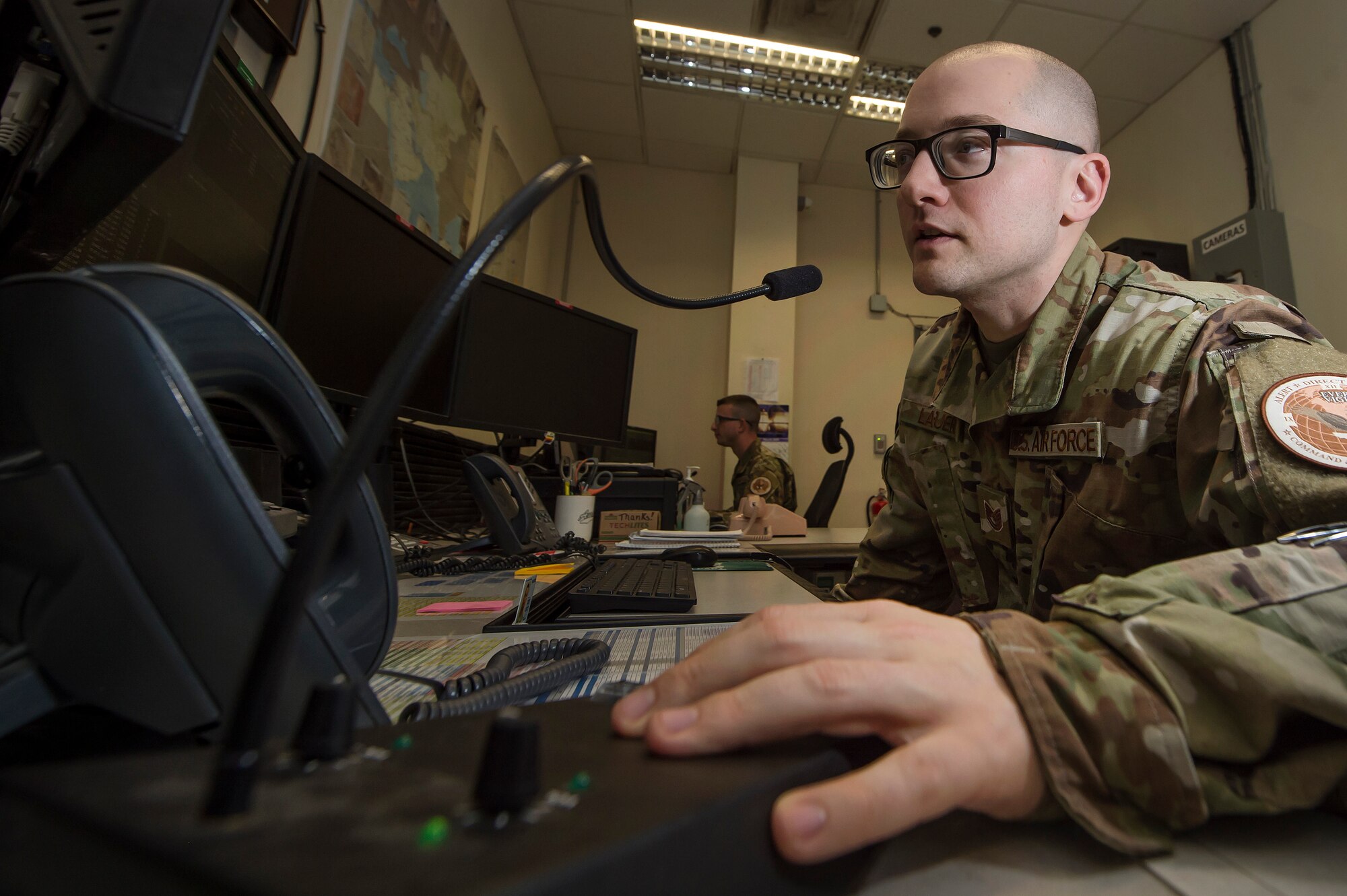 Tech. Sgt. Edward Lauer, 379th Air Expeditionary Wing Command Post NCO in charge of command and control operations, performs a radio check with agencies across the installation March 22, 2019, at Al Udeid Air Base, Qatar. Airmen from the command post are responsible for gathering and relaying information to entities across base to include aircraft maintenance requirements, security forces incidents, and notifications that ensure the safety of Airmen and other assets on base. (U.S. Air Force photo by Tech. Sgt. Christopher Hubenthal)