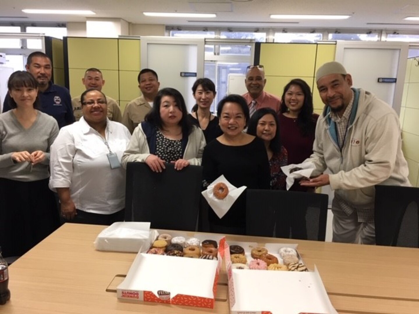 Evelyn Johnson, a new contract specialist in DLA Troop Support Indo-Pacific’s Procurement West Pacific Office, stands with her team in Yokosuka, Japan, March 2019.