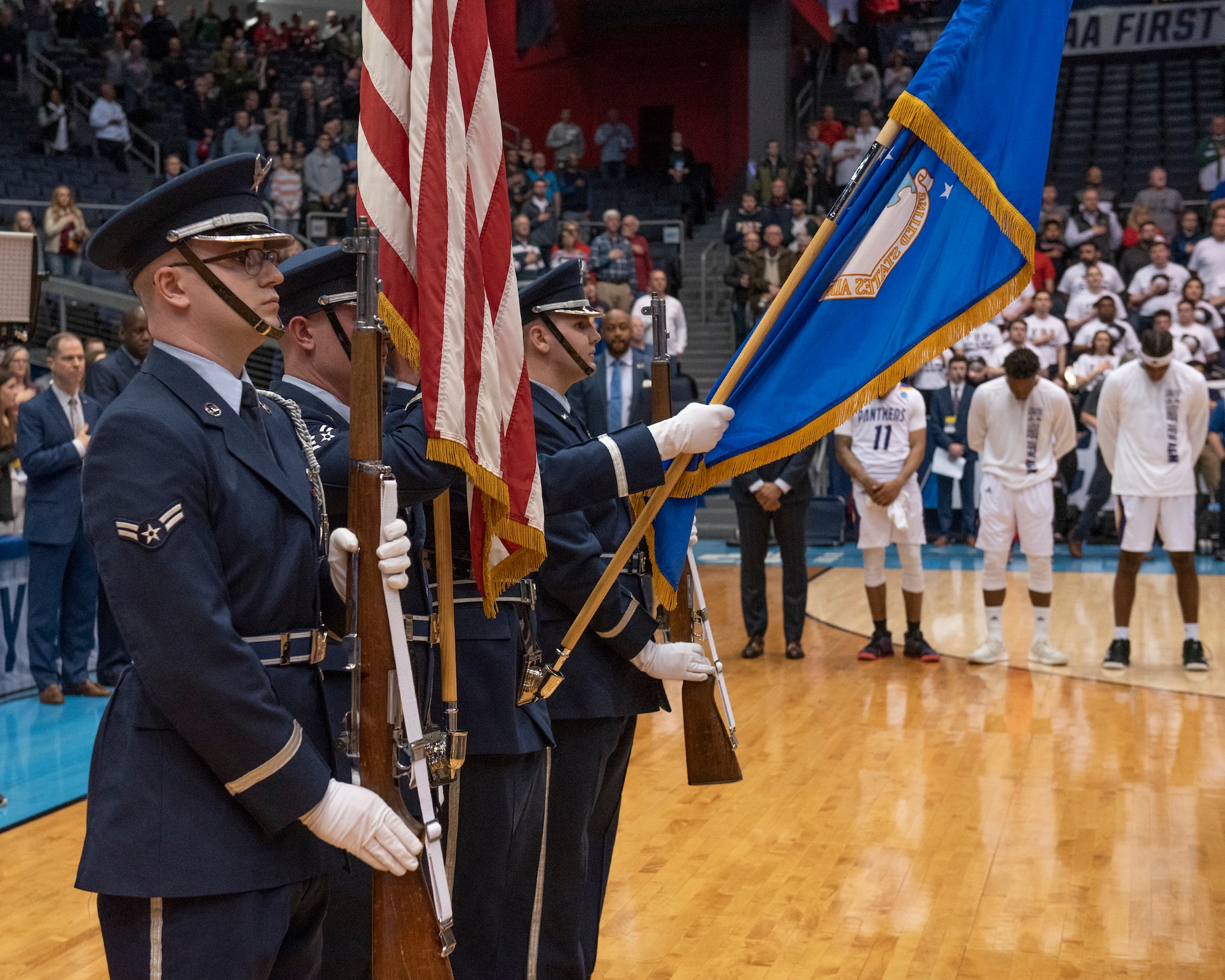 Members of the Wright-Patterson Air Force Base, Ohio Honor Guard present the colors during the pregame ceremonies of the NCAA First Four Tournament March 19, 2019. (U.S. Air Force photo by Michelle Gigante)