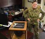 Master Sgt. Jennifer Martin, the superintendent of the 97th Wing Staff Agency, stands behind her desk and Military Training Instructor campaign hat, March 13, 2019, at Altus Air Force Base, Oklahoma. In addition to being a former MTI, she has served at nine different bases and has deployed once in her almost 23-year career as a medical administrative specialist.