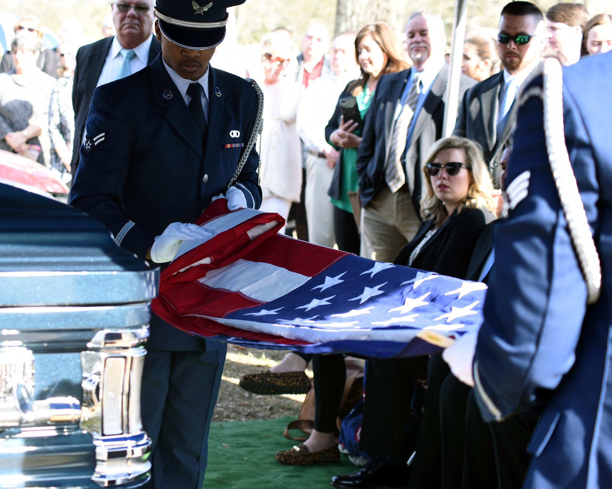 Airman 1st Class Donovan Ervin and Senior Airman Sean Perry, Columbus Air Force Base ceremonial guardsmen, folds an American Flag at John Cockerham’s, a local World War II veteran, funeral March 16, 2019, Center Hill Baptist Church Cemetery in Hamilton, Mississippi. Cockerham served in the Army Air Corps, the precursor the Air Force, as a B-17 gunner. (U.S. Air Force photo by Sharon Ybarra)