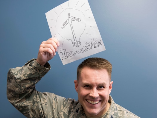 U.S. Air Force Col. J. Scot Heathman, 92nd Air Refueling Wing vice commander, holds up a logo idea for the new ‘Inland Spark’ thinker space being built at the Red Morgan Center at Fairchild Air Force Base, Washington, March 19, 2019. The space is an investment to empower Airmen to cultivate innovative ideas, giving them space to collaborate with others and model products. (U.S. Air Force photo by Senior Airman Ryan Lackey)