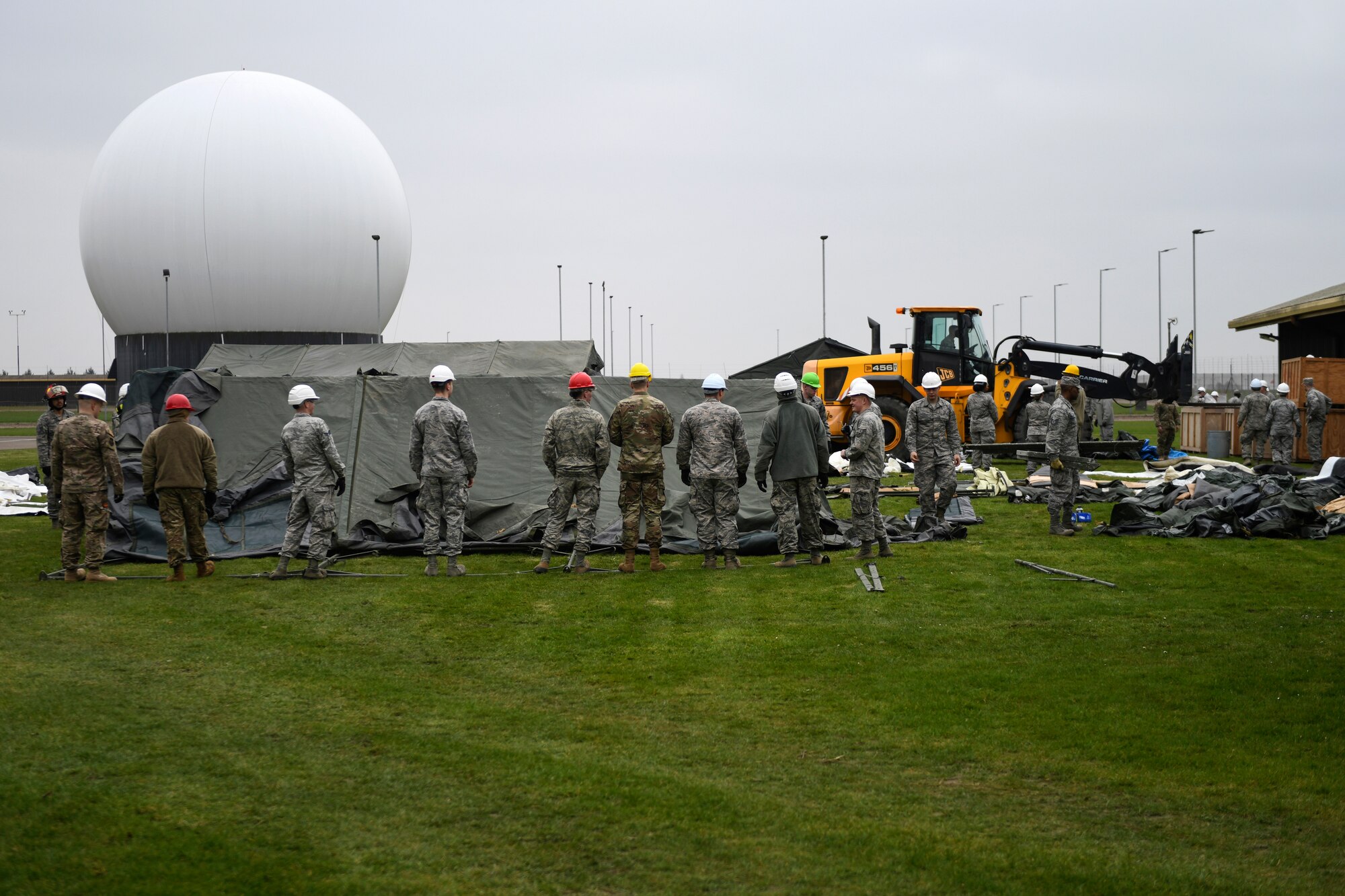 48th Civil Engineer Squadron members prepare to lift a Tent Extendable Modular Personnel tent during an inventory check and training day at Royal Air Force Feltwell, England, March 22, 2019. These types of trainings support the 48th Fighter Wing mission of generating combat-ready airmen. (U.S. Air Force photo by Senior Airman Malcolm Mayfield)