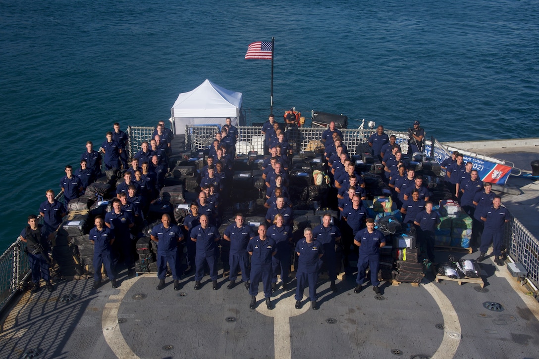 Pictured is the Coast Guard Cutter Tampa (WMEC-902) crew standing among approximately 27,000 pounds of seized cocaine Mar. 22, 2019 at Coast Guard Base Miami Beach.
