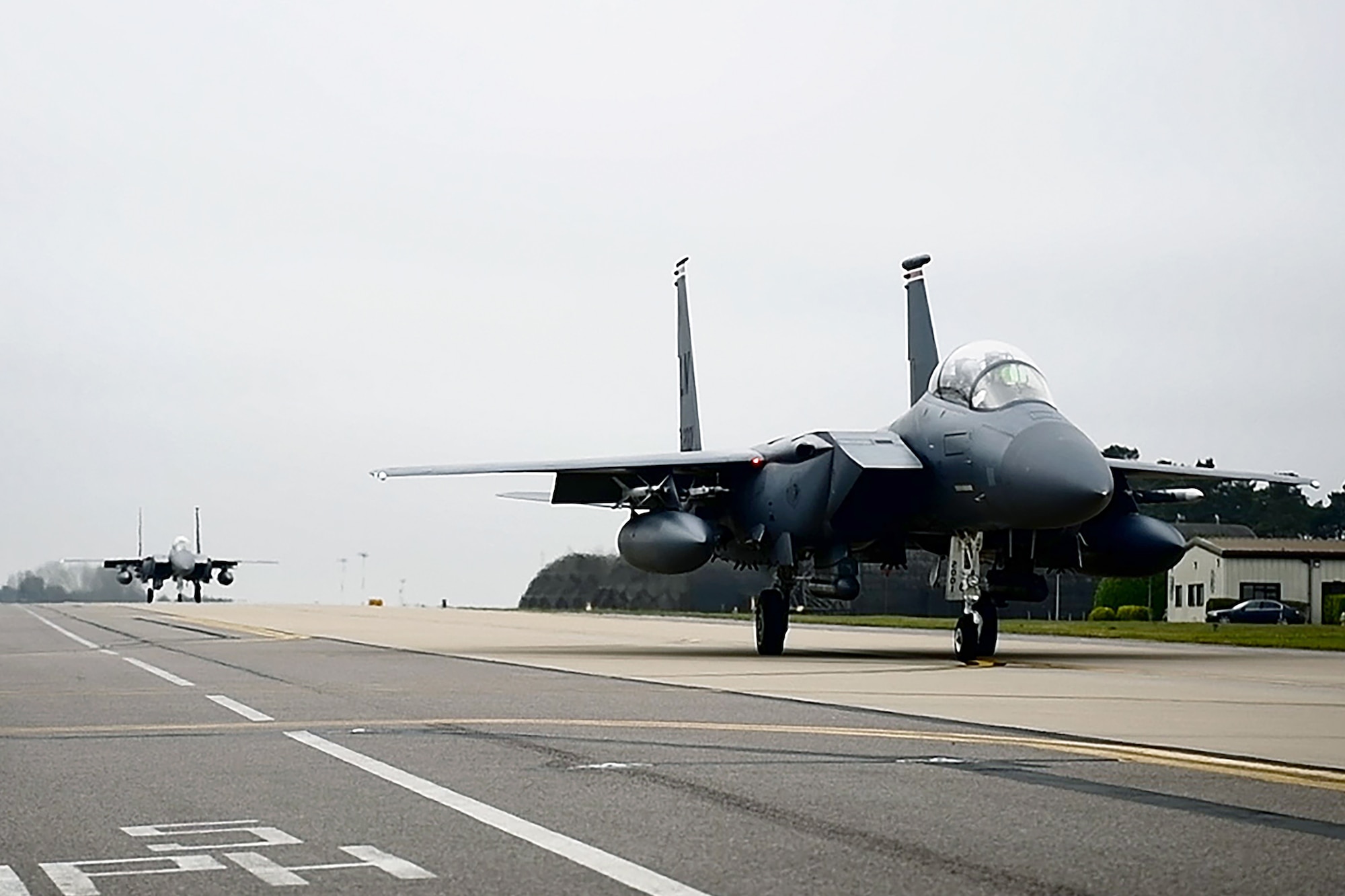 F-15E Strike Eagles taxi on the flightline at Royal Air Force Lakenheath, England, March 22, 2019. 492nd and  494th Fighter Squadrons joined Royal Air Force personnel and aircraft in the latest iteration of exercise Point Blank in Yorkshire, England. (U.S. Air Force photo by Airman 1st Class Shanice Williams-Jones)