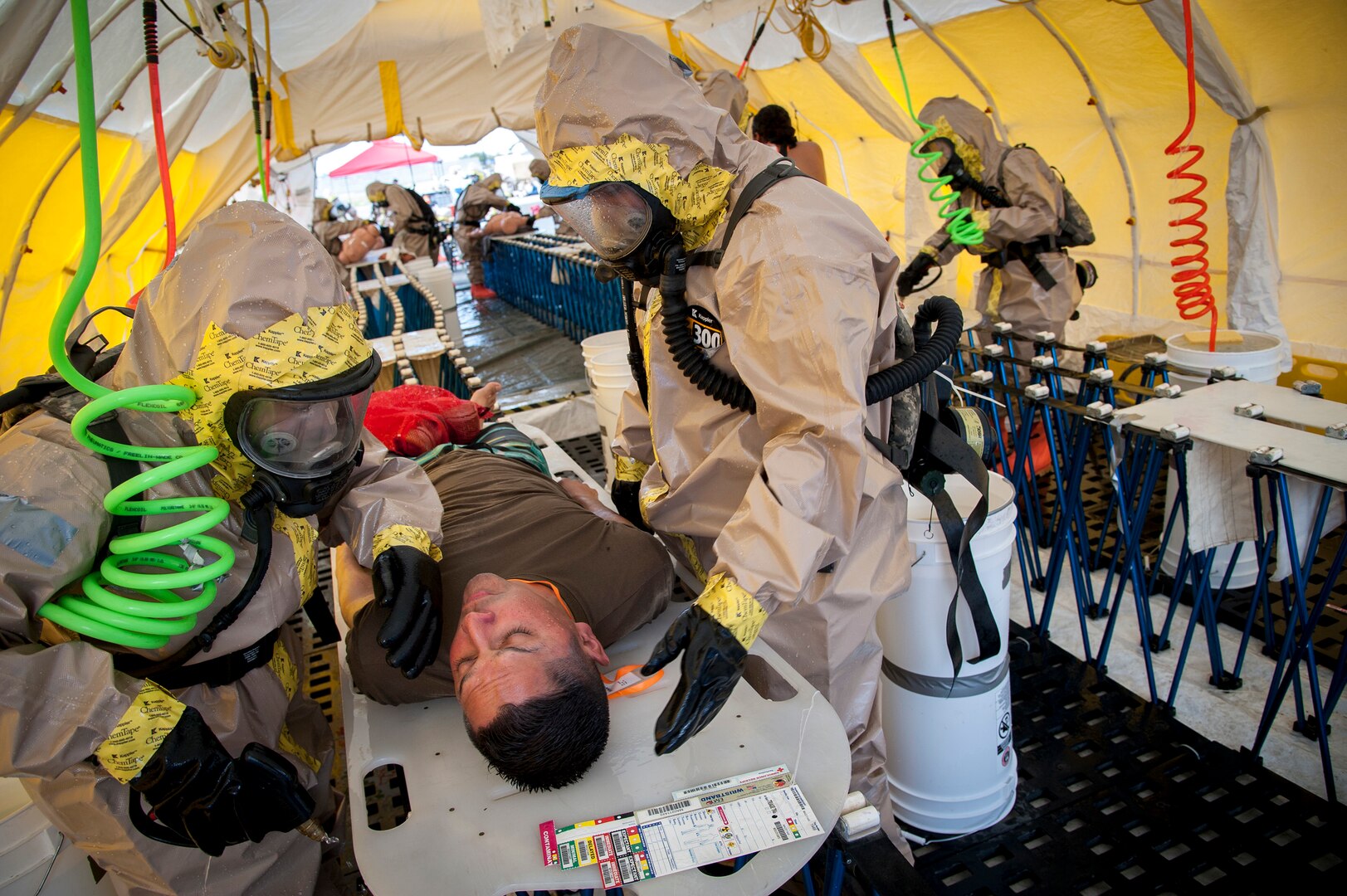 Hot-zone team members from Hawaii’s Chemical, Biological, Radiological, Nuclear, and High-Yield Explosive, Enhanced-Response-Force-Package Team (CERFP) process simulated casualties through a non-ambulatory decontamination zone during an evaluation exercise March 9, 2019, at Kalaeloa, Hawaii.