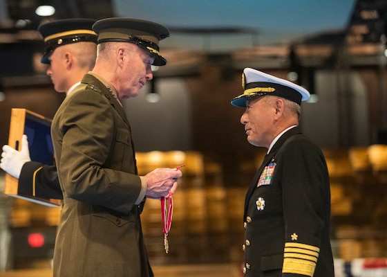 Marine Corps Gen. Joe Dunford, chairman of the Joint Chiefs of Staff, present a Legion of Merit to Japan Maritime Self-Defense Force Adm. Katsutoshi Kawano, chief of staff, Joint Staff, Japan Self-Defense Forces on Joint Base Myer-Henderson Hall, March 21, 2019.