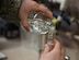 Staff Sgt. Shane Pentheny, 22nd Civil Engineer Squadron Water and Fuels System Maintenance technician, pours water into a small vial in order to test the chlorine, fluoride and pH levels March 9, 2017, at McConnell Air Force Base, Kan. If the samplings yield low readings, which sometimes happens in low-use buildings, the normal procedure is to flush the building until desired results are achieved. (U.S. Air Force photo/Airman 1st Class Erin McClellan)