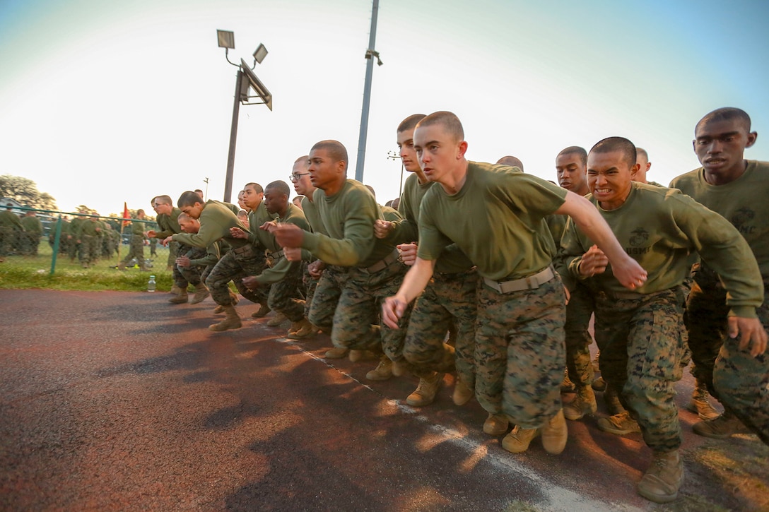 Marine Corps recruits prepare for a combat fitness test.