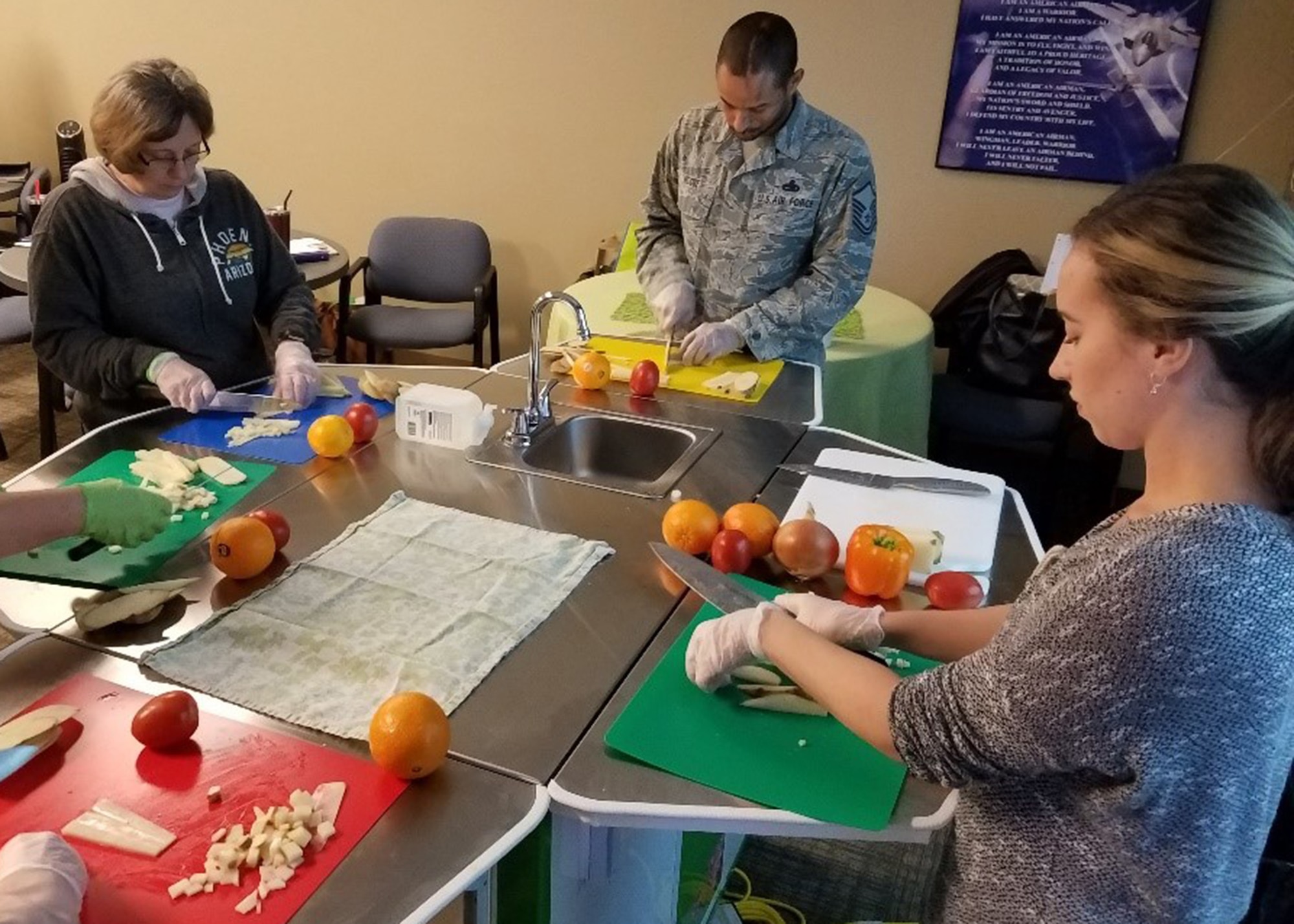 Attendees of a food demonstration training course practice preparing fresh vegetables Feb. 8, 2019, at Luke Air Force Base, Ariz.