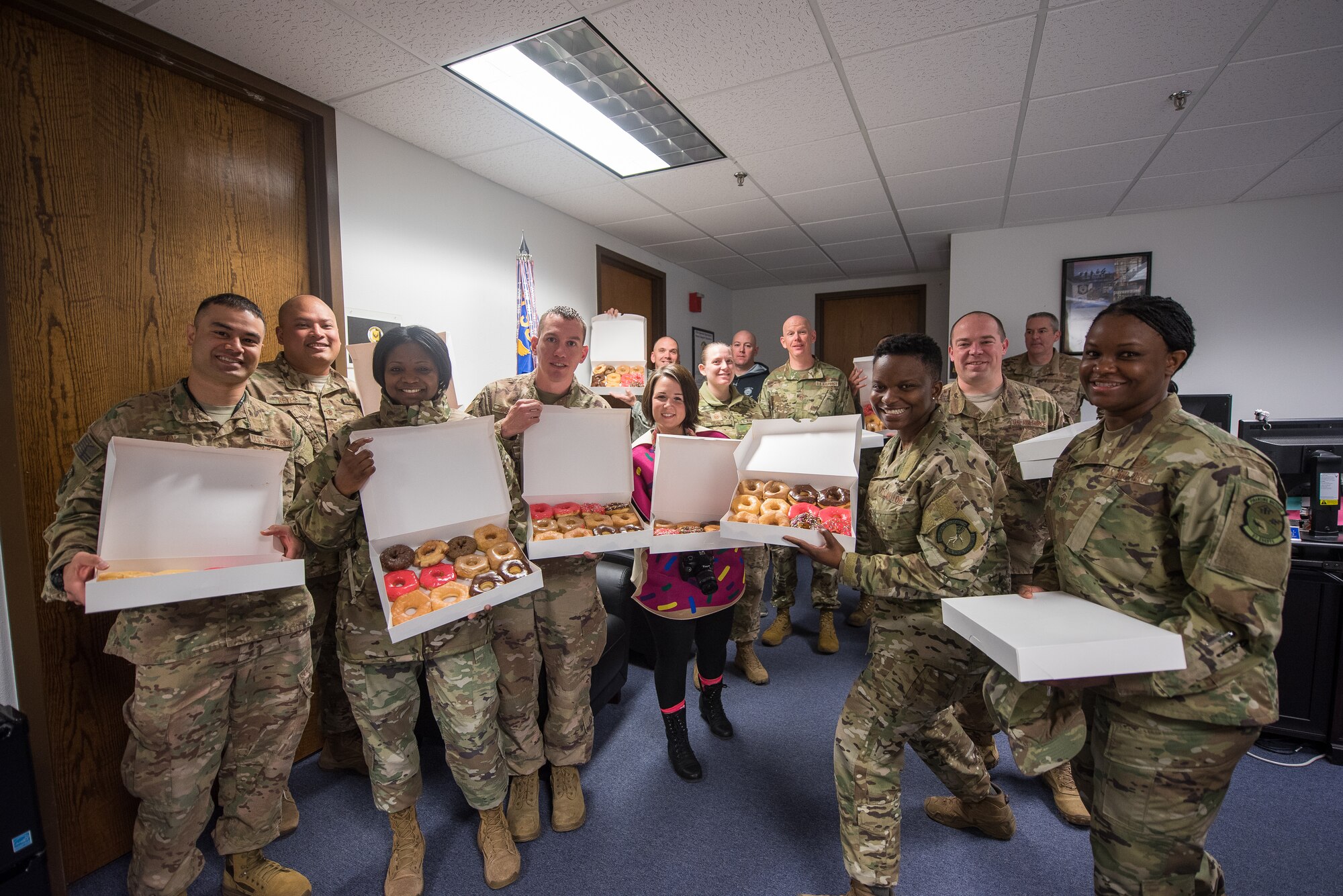 First sergeants from the 27th Special Operations Wing pose with donuts for the inaugural Diamonds and Donuts event at Cannon Air Force Base, N.M., March 22, 2019. The first sergeants hand-delivered the donuts to 27th Special Operations Force Support Squadron Air Commandos. (U.S. Air Force photo by Airman 1st Class Vernon R. Walter III)